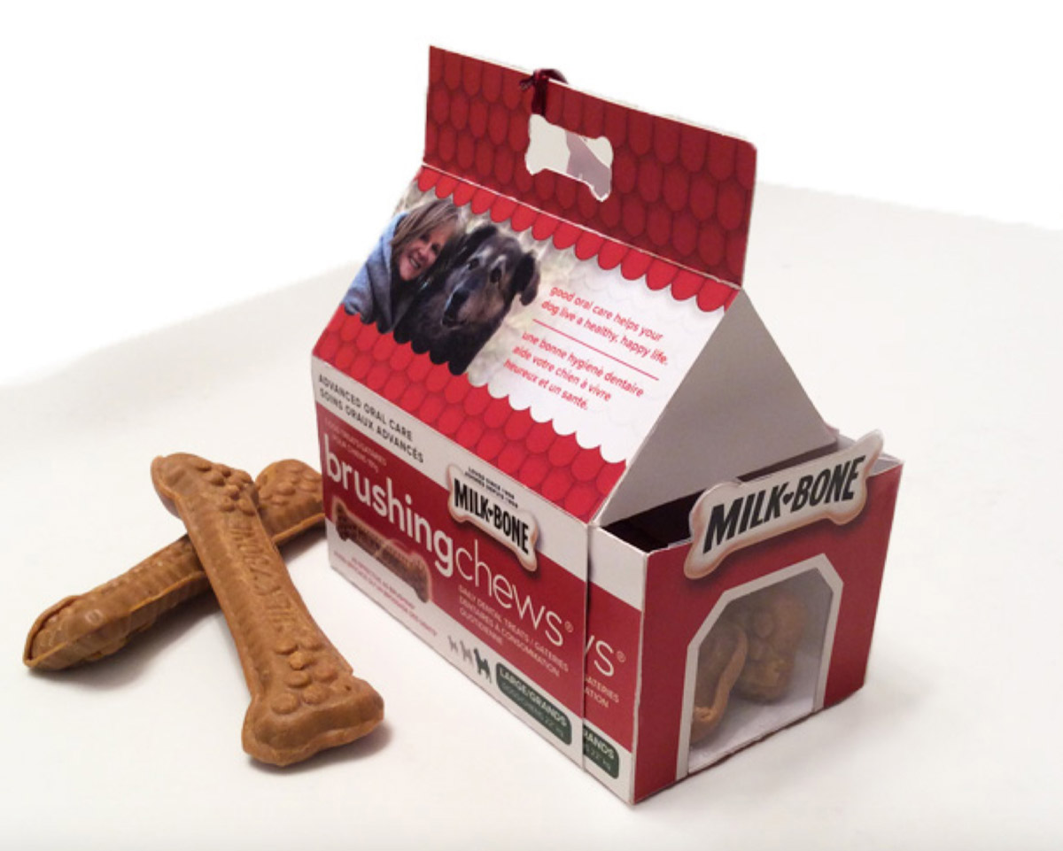 A doghouse shaped packaging box for dog treats